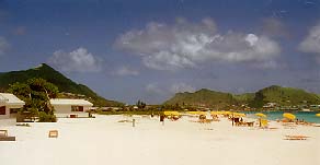 [IMG: Orient Beach, with some beach chalets on the left]